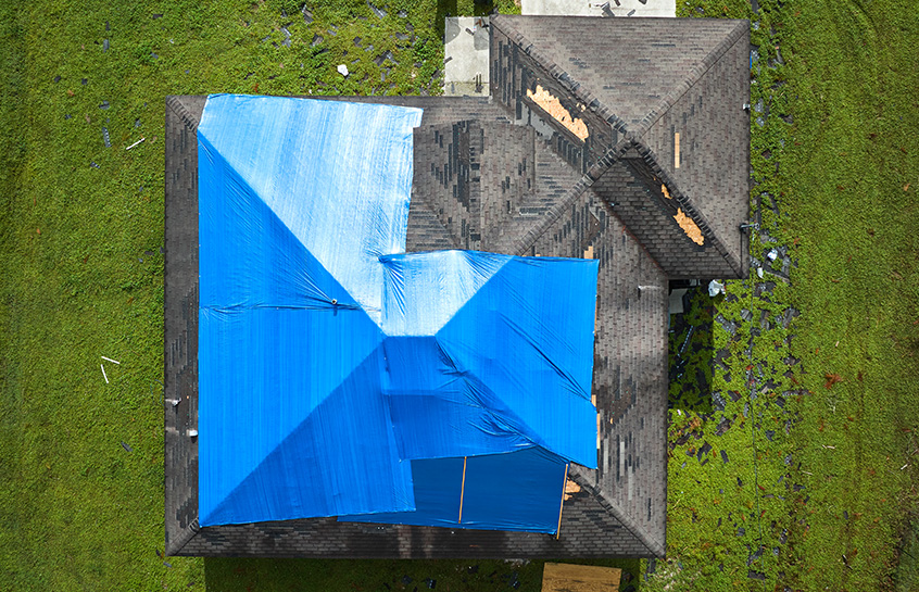 Broken and missing asphalt shingles on Grand Rapids Area Roof